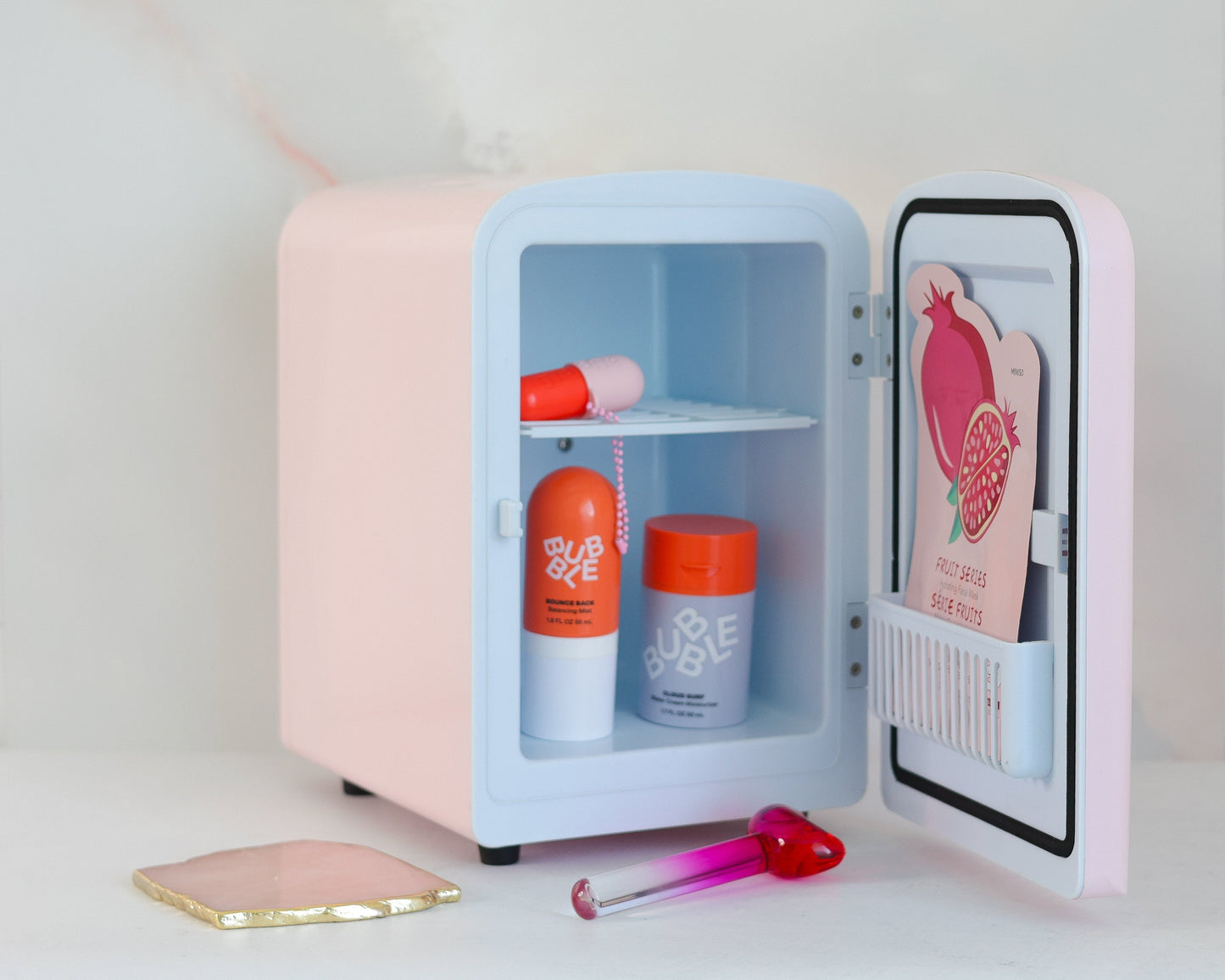 Cool Girl Fridge in pink -  styled on vanity desk with skincare