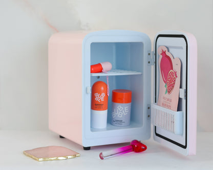 Cool Girl Fridge in pink -  styled on vanity desk with skincare